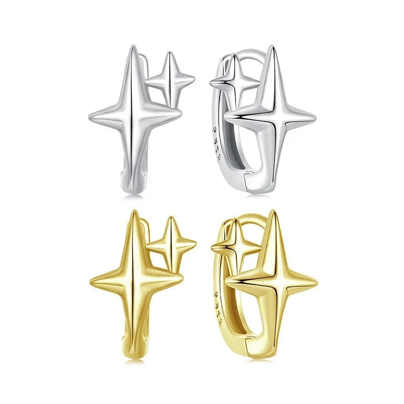 Minimalist star-shaped silver ear clips with an oxidised finish and XINGX design detail.