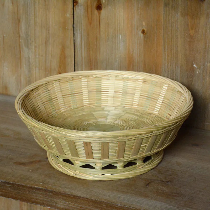Handmade woven bamboo storage basket in natural colour showing three size variations