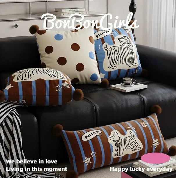Blue cartoon anime print decorative sofa cushion pillow on a grey sofa.