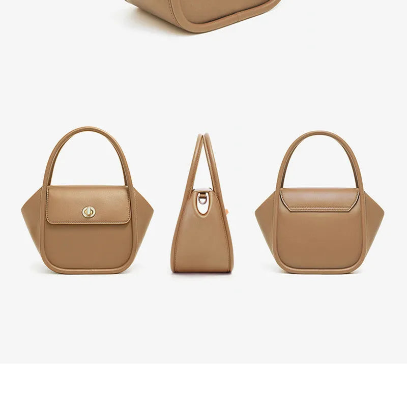 A women's cow leather wing-shaped handbag with a latch closure and a single shoulder strap.