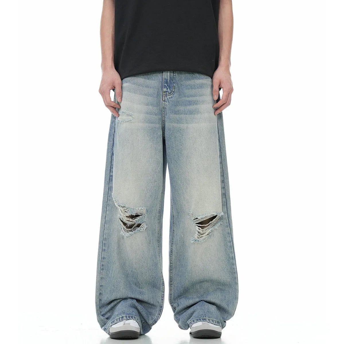 Men's blue distressed straight-leg retro jeans with a zip fly on a plain background.