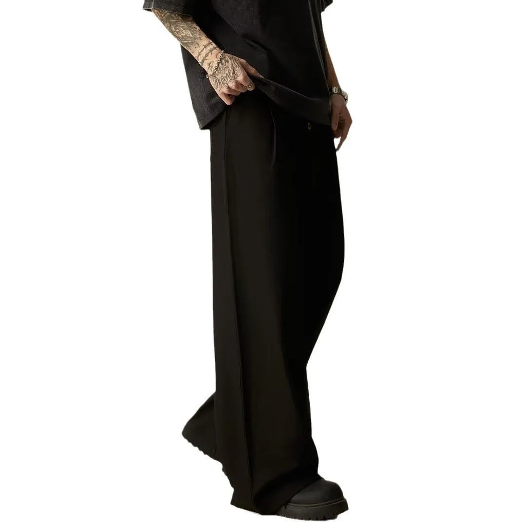 Men's solid black wide-leg casual trousers with a straight-leg cut and elasticised waist.