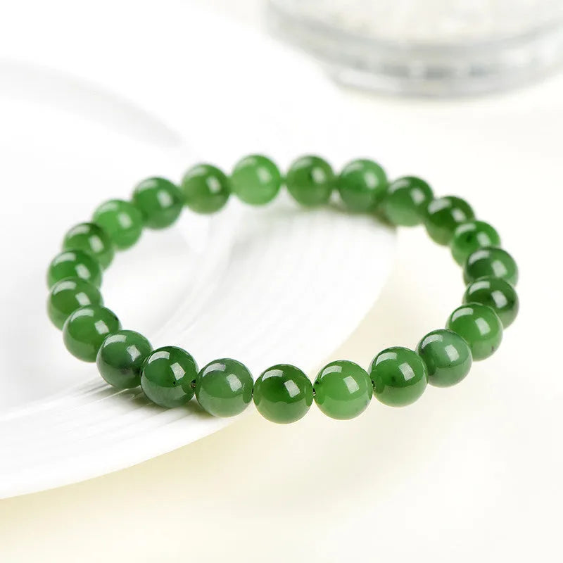 Natural Jasper bead bracelet on Hetian jade string showing polished stones in various sizes.