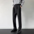 Men's apricot and black loose straight-leg suit trousers on hanger with size tags