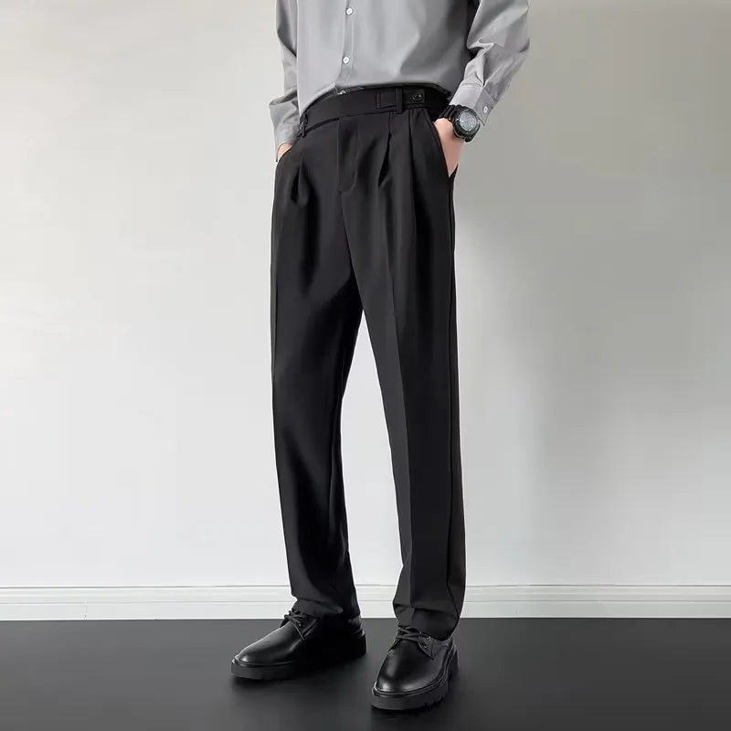 Men's apricot and black loose straight-leg suit trousers on hanger with size tags