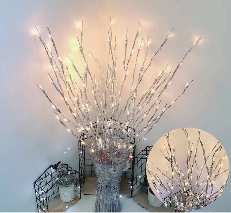 LED decorative tree light in a vase with colourful or warm white lighting options.