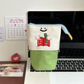 Brown Korean-style cartoon collapsible pencil case made from Oxford fabric, shown open and closed.