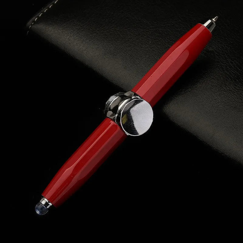 Metal gyro spinner ballpoint pen showing writing tip and spinning mechanism with LED lights