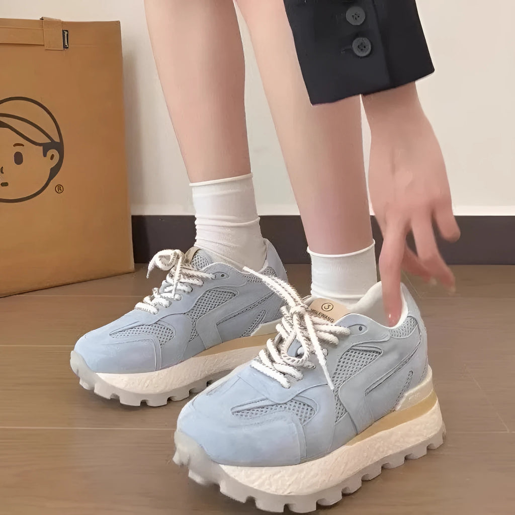 Women's platform sneakers in blue, apricot or yellow with 3-5cm mid heel, synthetic leather upper and rubber sole.