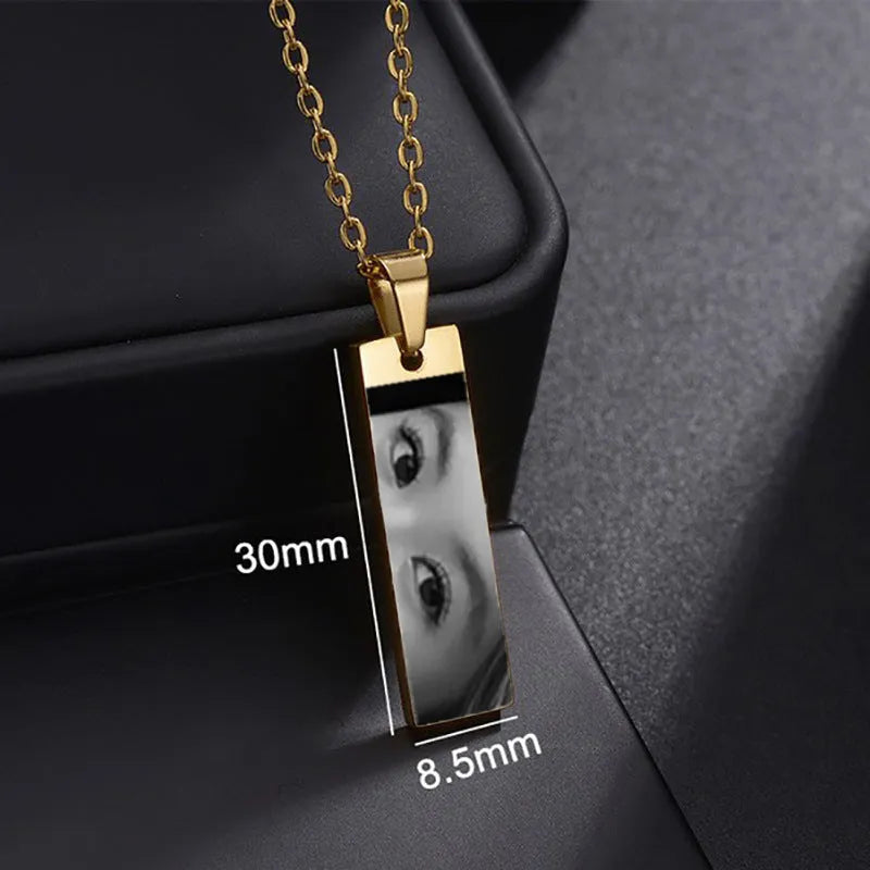 Custom stainless steel photo necklace with engraved eye design, geometric shape, and electroplating finish in a range of colours