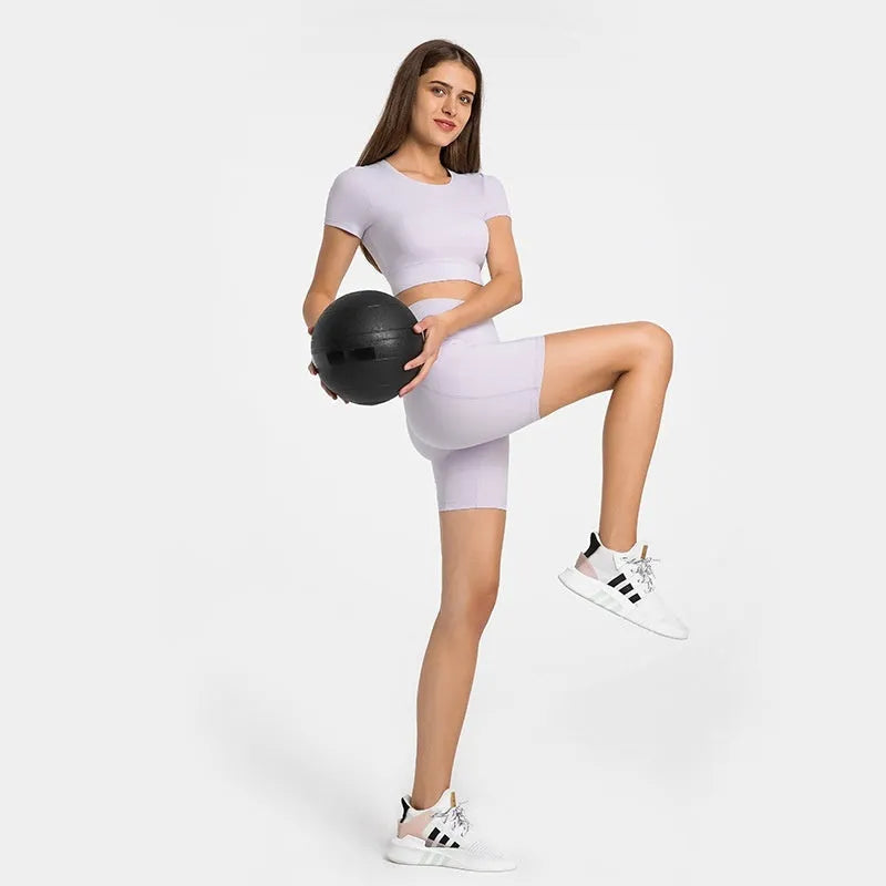 Women's tight-fitting super stretch sports shorts in a solid colour, shown on a model.