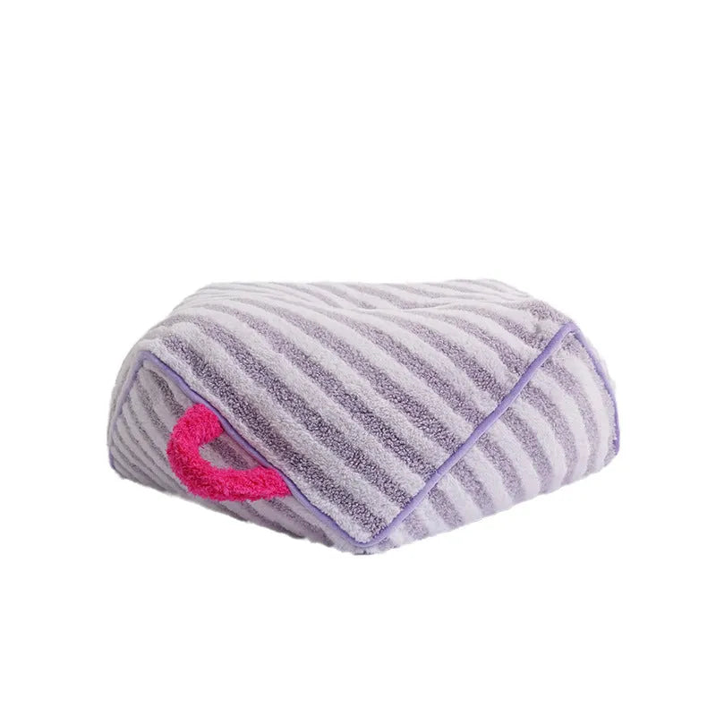 Striped orange plush dog bed with a removable cover for small to medium dogs.