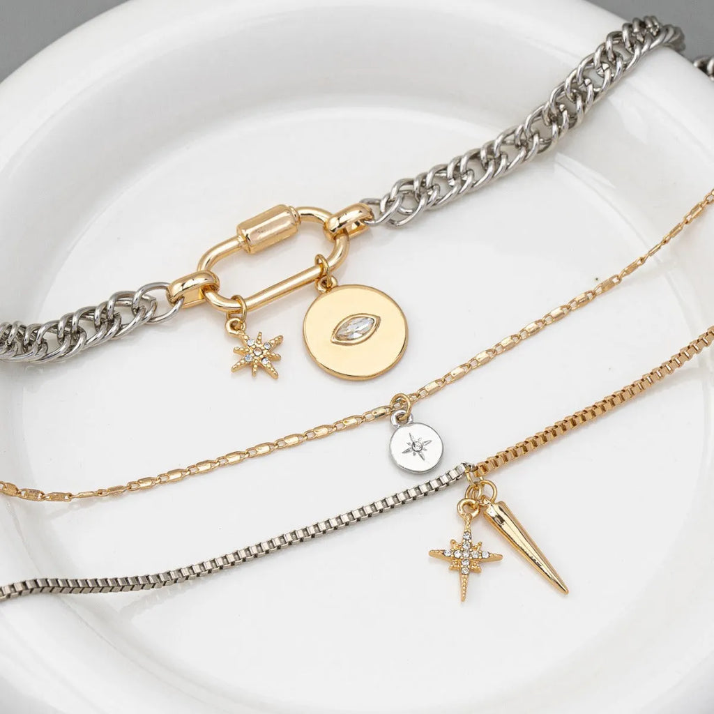 Eye pendant multi-layer twin necklace for women with alloy electroplated clavicle chain and geometric ellipse shapes.