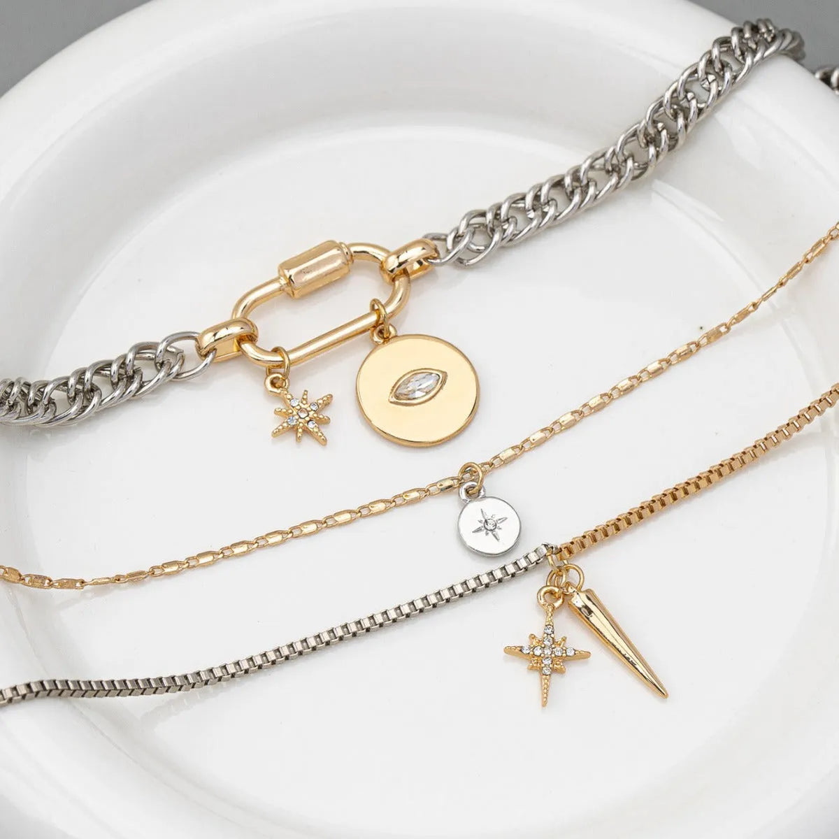 Eye pendant multi-layer twin necklace for women with alloy electroplated clavicle chain and geometric ellipse shapes.