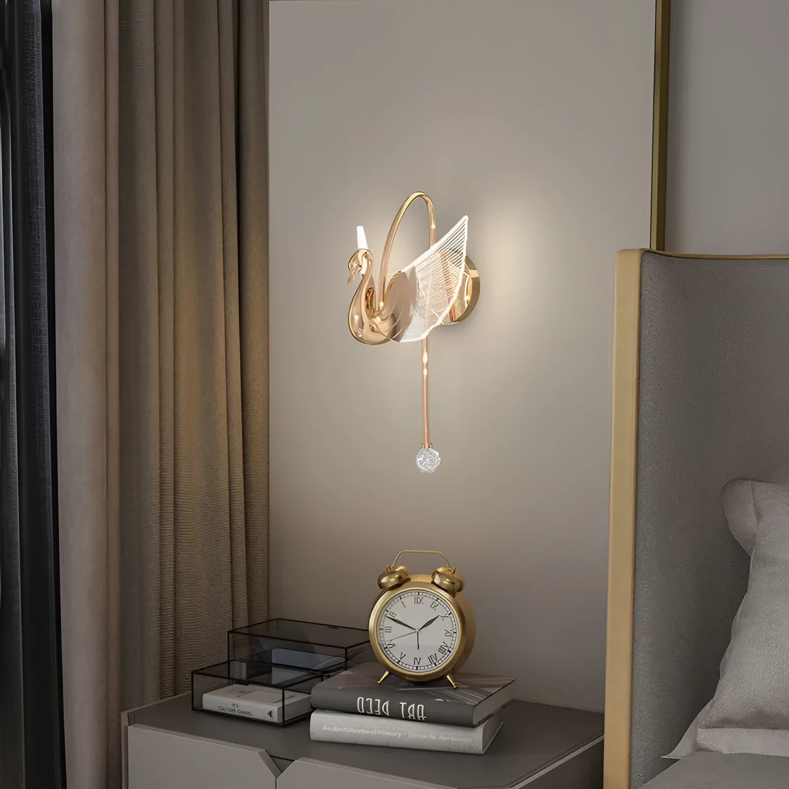 Modern minimalist gold swan-shaped LED wall lamp for bedside lighting.