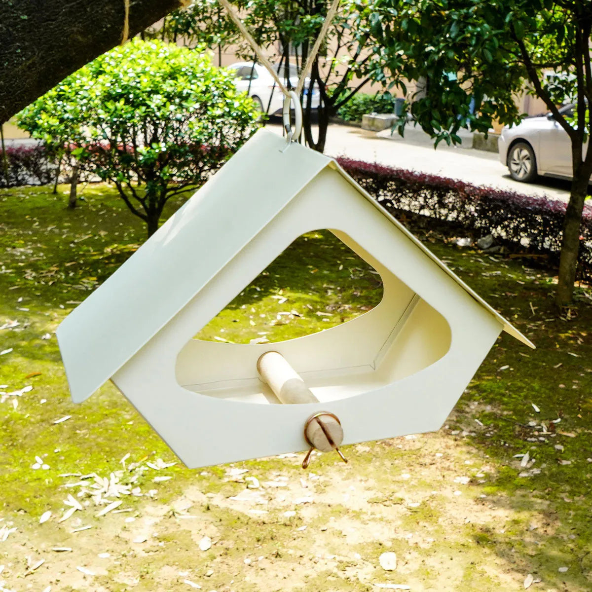 Simple iron bird nest feeder with anti-rain design in a modern style for outdoor courtyard use.