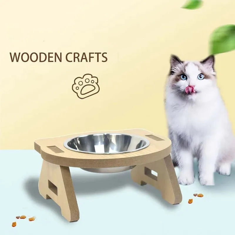 Wooden cat feeder with two stainless steel bowls for food and water on an anti-tip base.