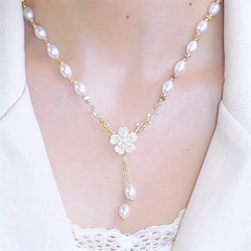 Alloy necklace with pearl flower pendant and floral design elements