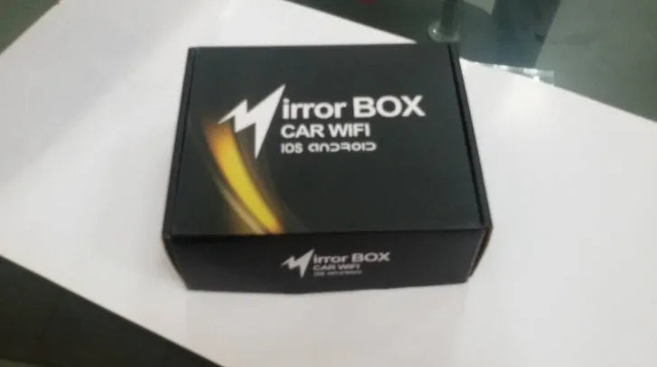 Black car mirror link box host unit with connecting AV cable, power cable, and antenna.