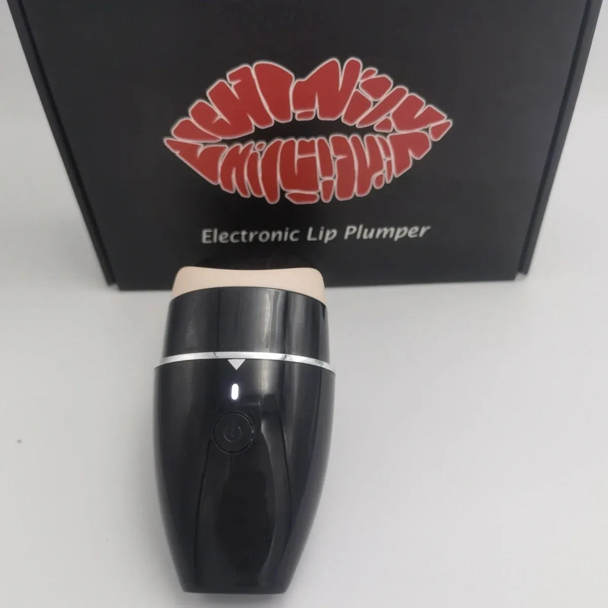 Black and white electric silicone lip plumper device with 3-speed adjustment and USB charging cable