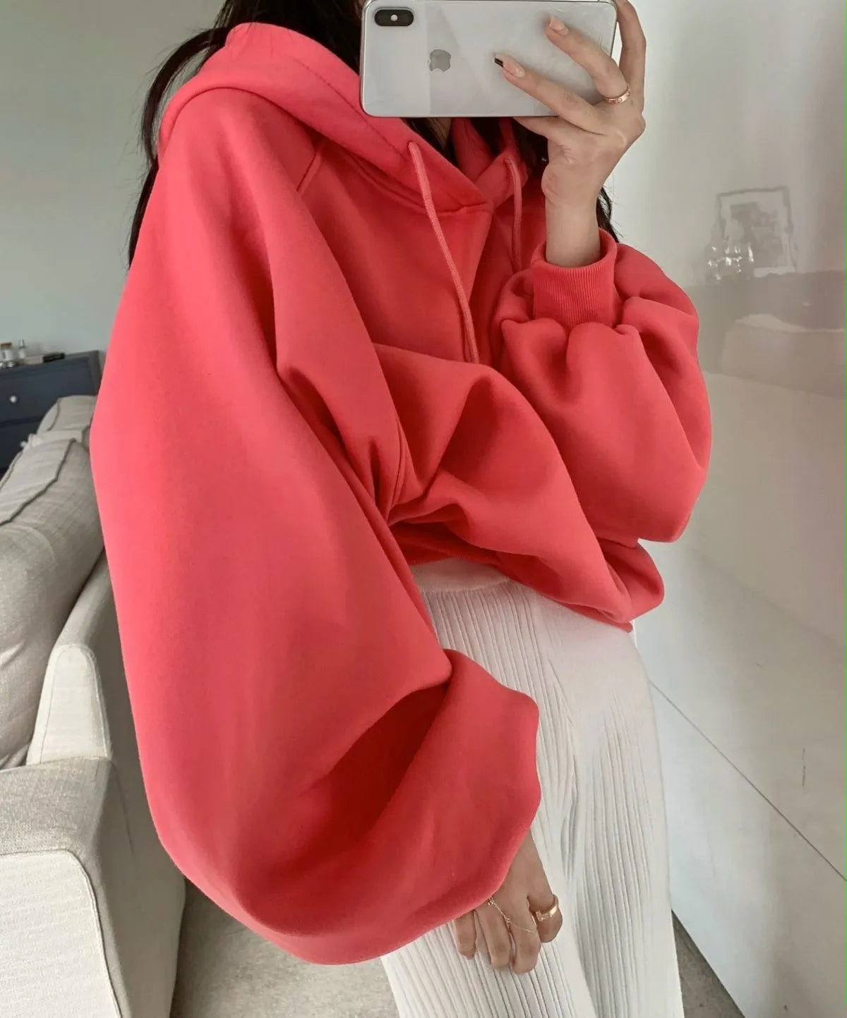 Women's loose watermelon red hooded sweater made from mulberry silk, shown sleeveless.
