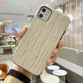 Slim wooden iPhone back cover in genuine bamboo or rosewood, showing natural grain, compatible with iPhone 11 Pro.