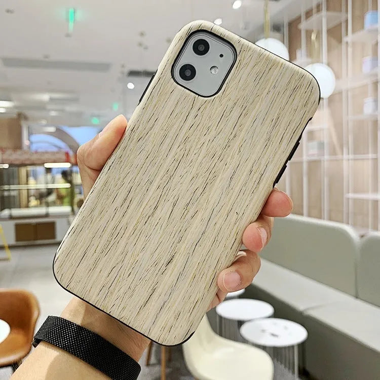 Slim wooden iPhone back cover in genuine bamboo or rosewood, showing natural grain, compatible with iPhone 11 Pro.