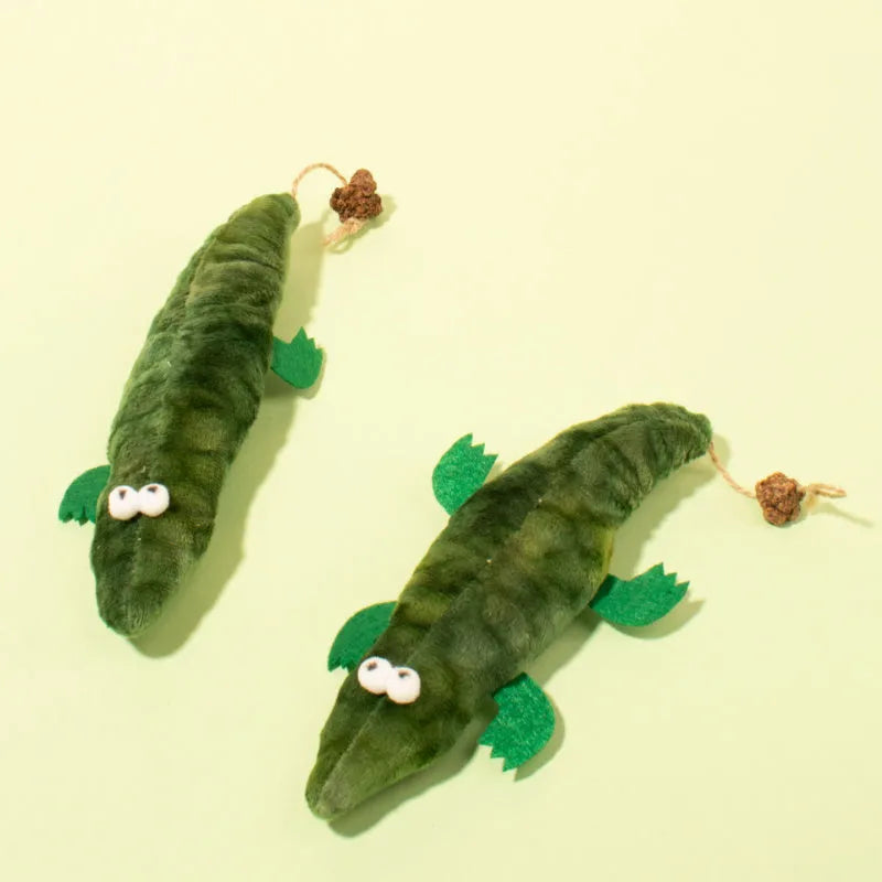 Green plush alligator cat toy measuring 30cm long with catnip pouch and peppermint scent