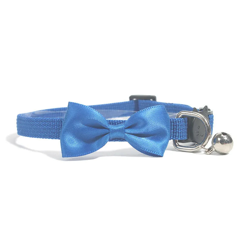 Adjustable nylon cat bow collar with a bell in a striped pattern, shown in a bright colour.