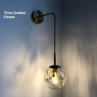 Modern simple glass wall-mounted bedside lamp in golden or silver finish.