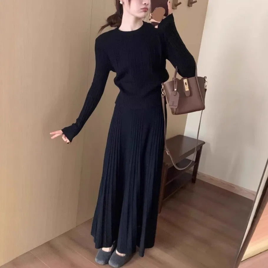 Dark grey knitted long dress suit with 3D pattern and collage stitching, shown with matching skirt.