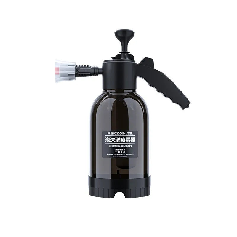 Black hand-held 2 litre foam sprayer with lock switch and nozzle attachments
