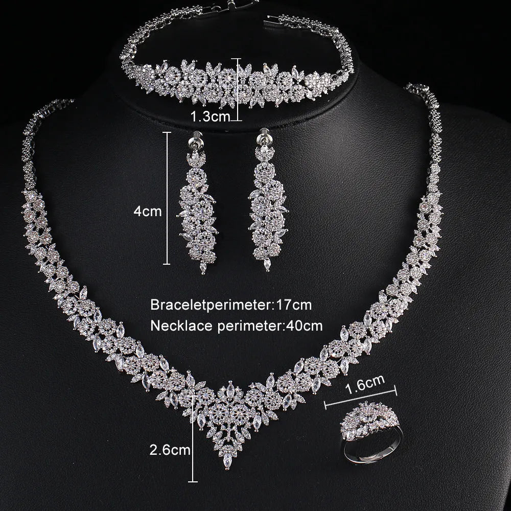 White copper bridal jewellery set with tassel earrings, necklace, bracelet, ring and snake bone chain