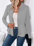 Women's black loose fit coat with a ruffled hem and a heavy-duty front zipper.