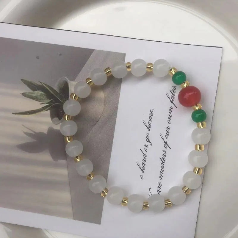 Chinese style glass bracelet with bamboo joint elements in red Lvzhu Duobao design