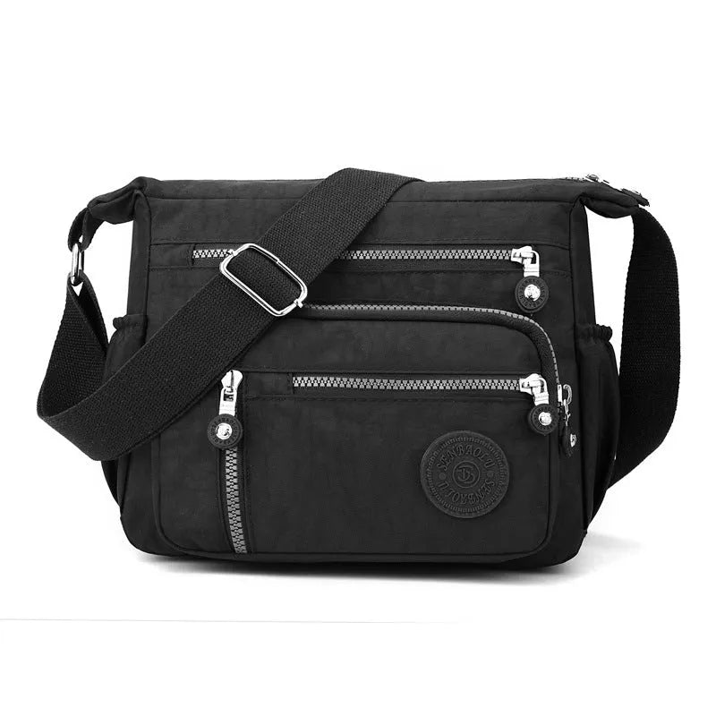 Grey square vertical nylon messenger bag with a single shoulder strap shown open.