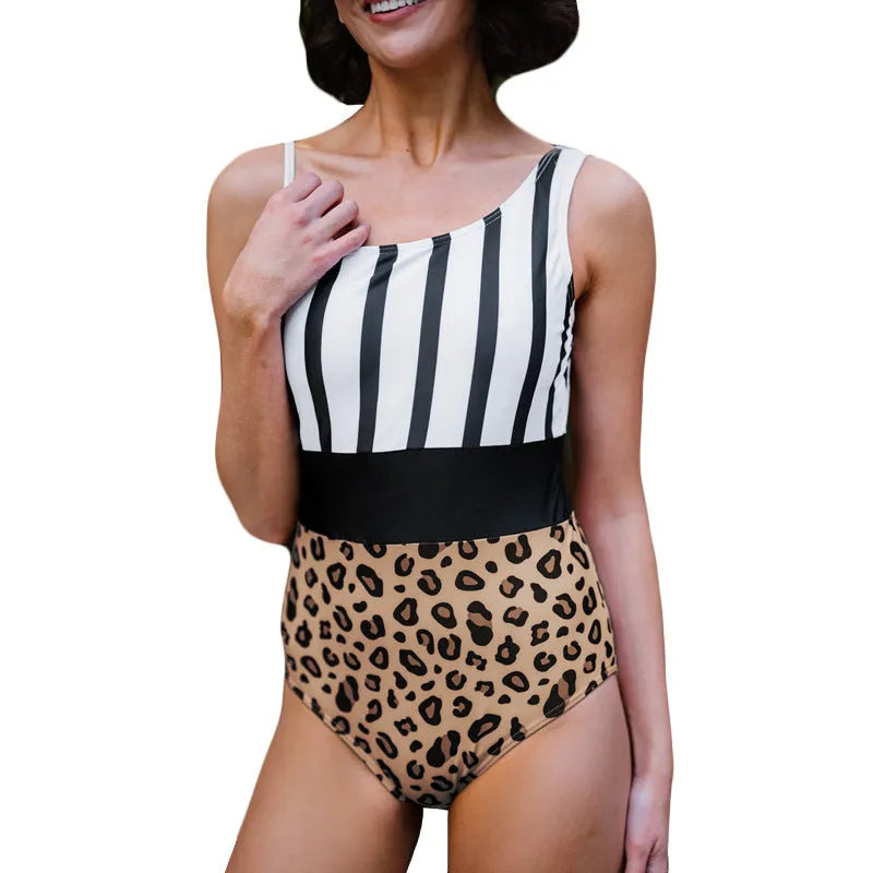 Women's leopard print one-piece swimsuit with an asymmetric collar and high-waisted brief cut.
