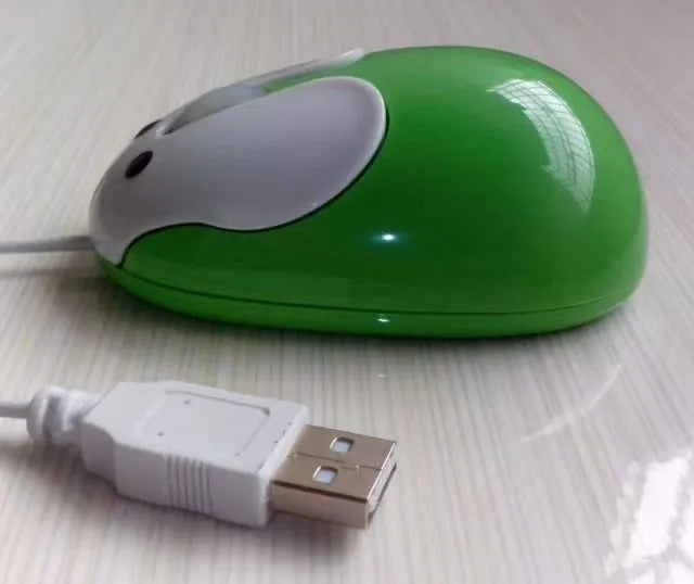 Pink wired rabbit mouse on desktop with USB cable and scroll wheel
