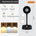 Modern geometric wireless rechargeable wall spotlight in black or white with remote control.