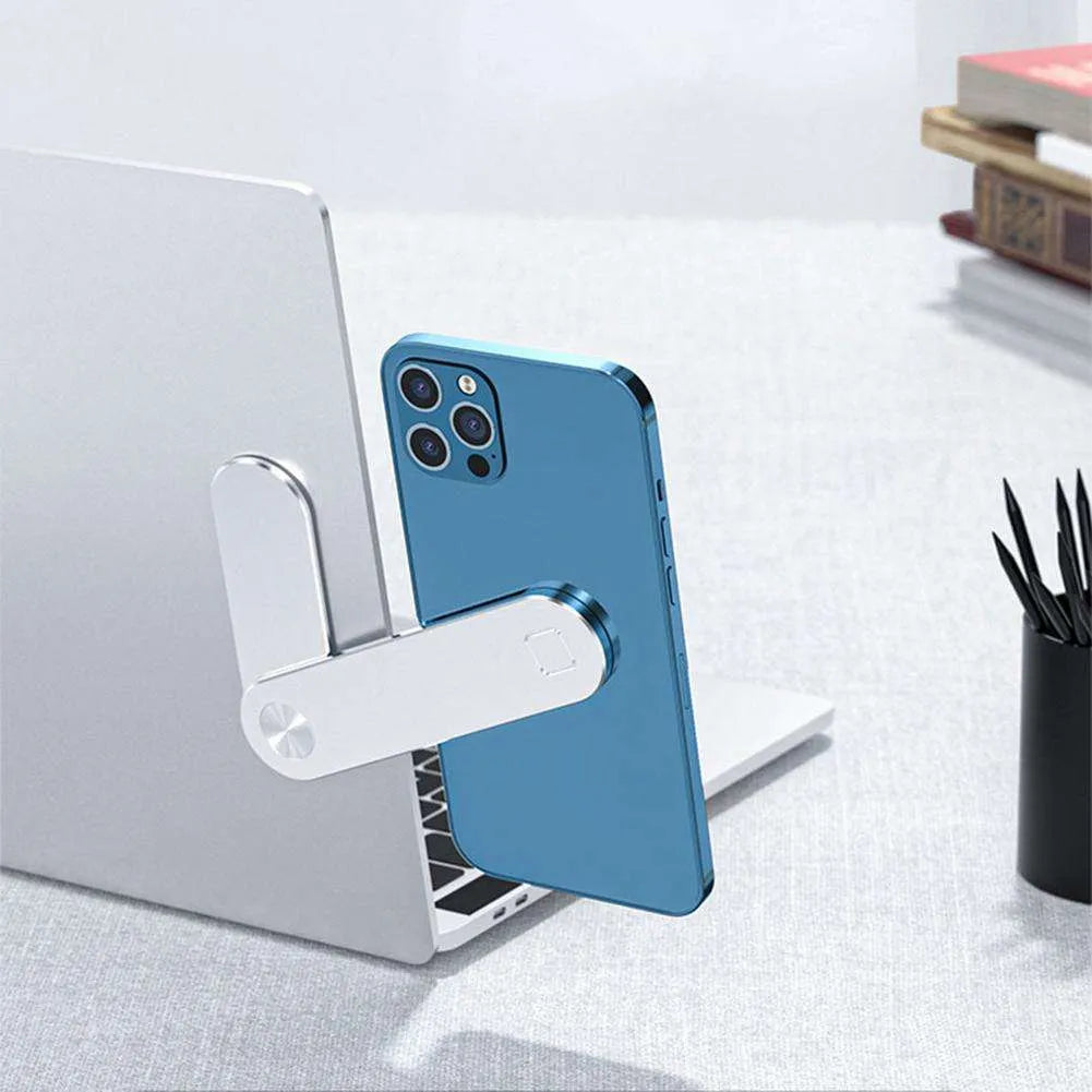 Black aluminum laptop phone holder clipped to a monitor, holding a smartphone and with headphones hanging from the hook.