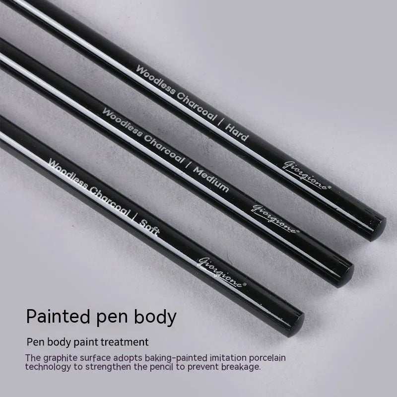 Set of six graphite and three carbonised drawing pencils with wooden casings on a white suction card.