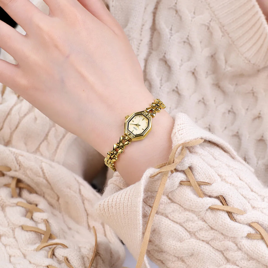 Octagonal women's quartz watch with 7.8mm alloy case, 17.5mm barrel dial, and steel gold finish