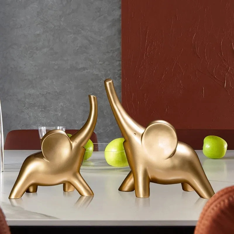 Modern resin and plastic elephant ornament in rose gold or white colour, available in large, small, or pair sizes.
