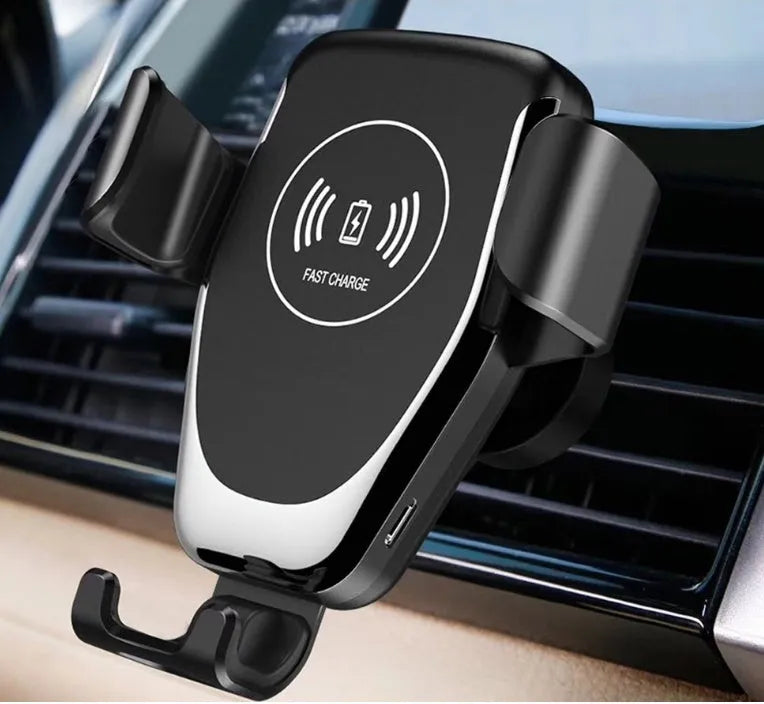 Black car Qi wireless charger with automatic clamp mounted on a vehicle air vent.