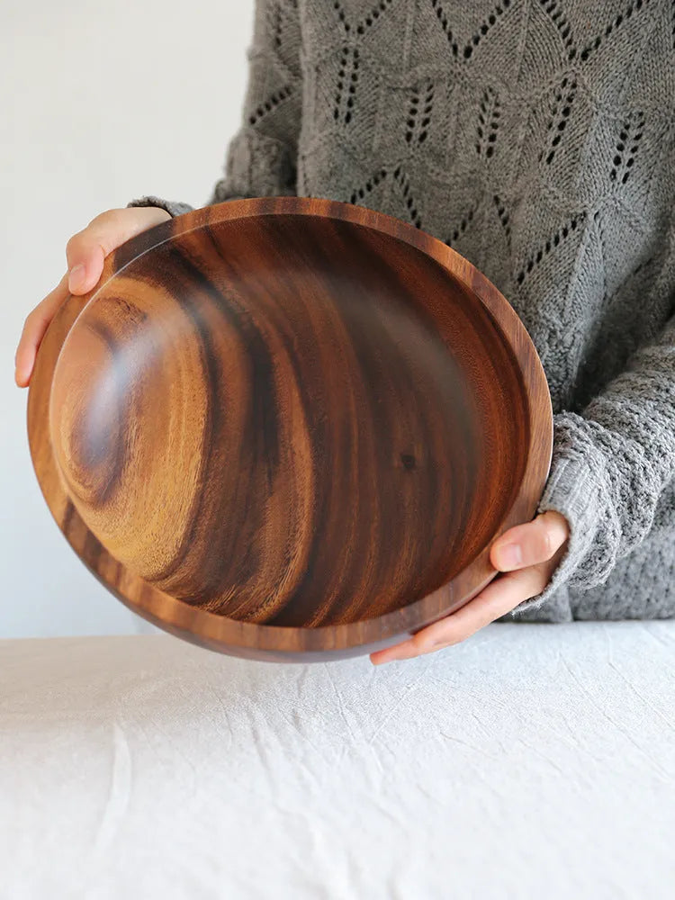 Brown handmade wooden bowl with natural wood grain and overglaze finish