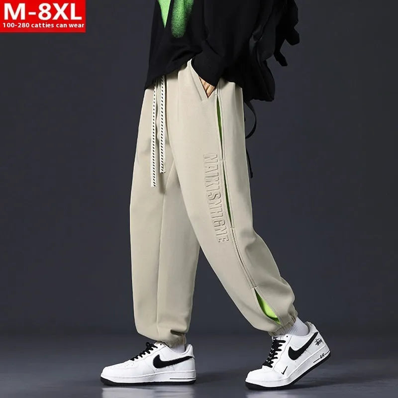 Men's black ankle banded trousers with stitching detail and cotton micro-elastic fabric