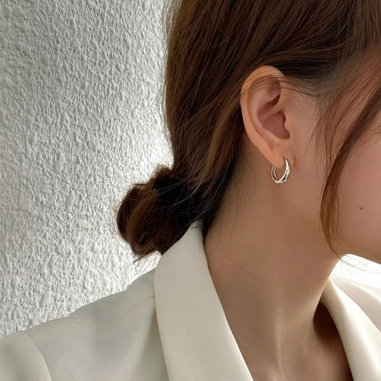 Women's minimalist geometric water drop earrings in gold or silver on a copper base, shown in large, medium, and small sizes.