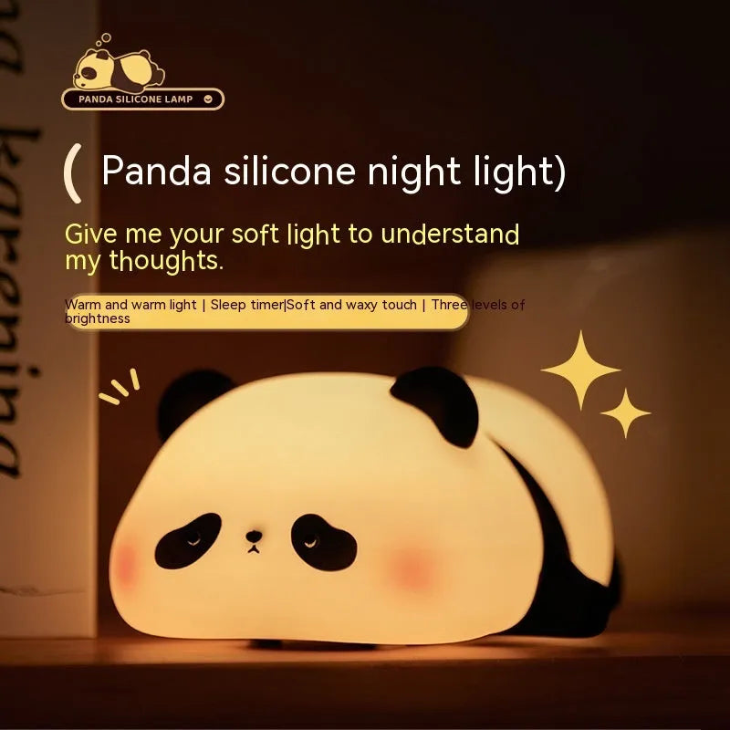 Panda-shaped night light with black and white silicone construction showing LED glow