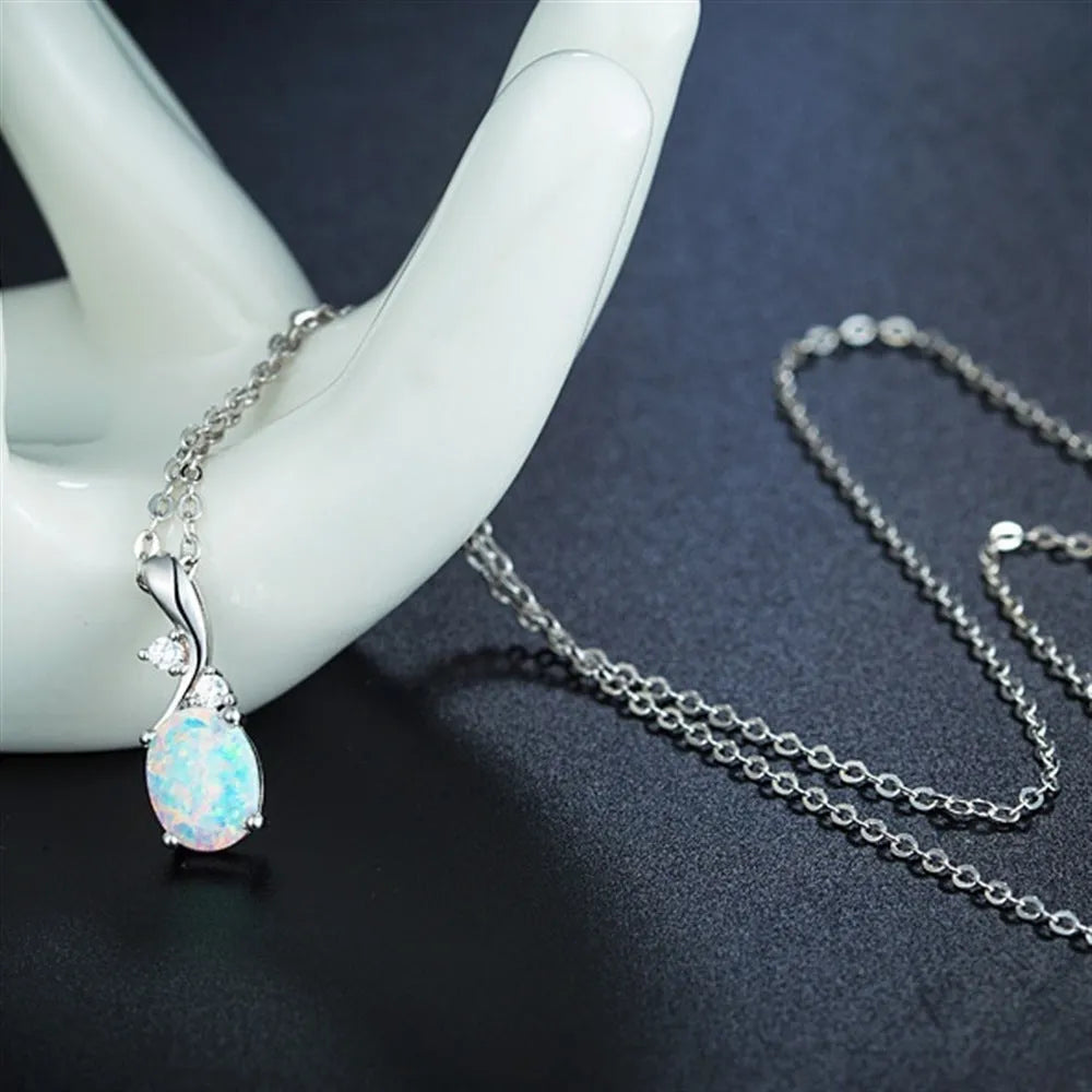 Water drop shaped opal pendant necklace on adjustable O-chain in rose gold or white finish