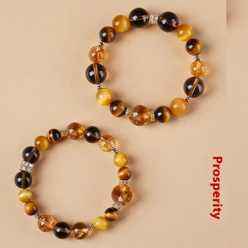Lucky Jinba natural yellow tiger-eye crystal bracelet with geometric beads, shown in 10MM and 12MM size options.